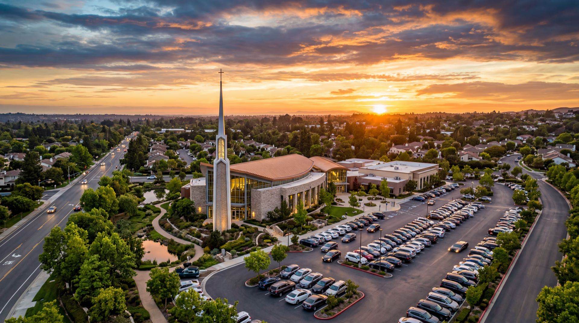 Aerial view of a modern church campus at sunset